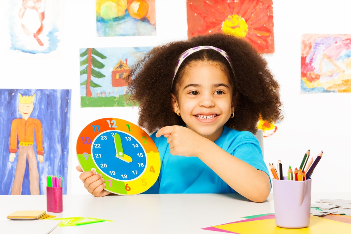 African Girl Holding Carton Clock Time